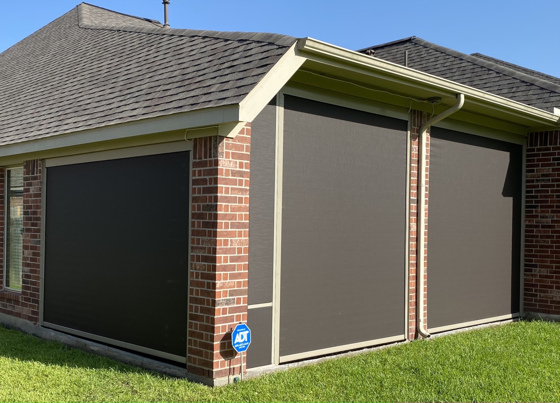 Motorized outdoor shades installed on a Woodlands TX patio